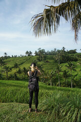 A woman walking around Tegalalang Rice field in Bali, Indonesia.