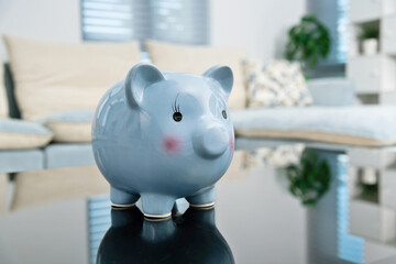 Blue piggy bank on living room table