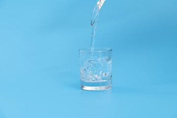 Pouring water into the glass