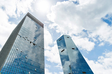 Modern office buildings under cloudy sky