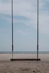 swing on the beach and blue sky background