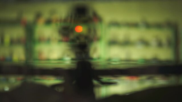 a man with a red dot sight on a crossbow wants to accurately hit the target. High-quality Full HD video recording. slow motion video