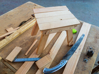 New wooden stool in the carpenter workshop