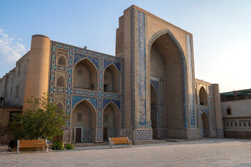 Fototapeta na wymiar Facade of medieval Mirzo Ulugbek madrasah on a sunny September morning. Bukhara