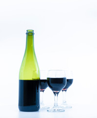 red wine bottle and glass isolated white background