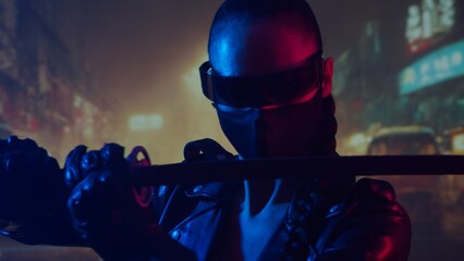 Cyberpunk ninja girl in a mask and with a katana. Beautiful female samurai woman on the background of Asian city downtown. © Acronym