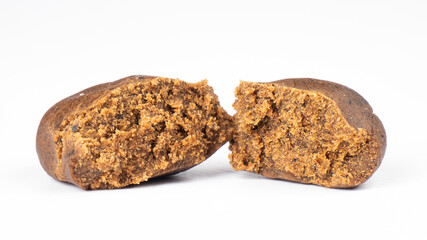 brown broken piece of cannabis concentrate hashish isolated on white background, hash weed