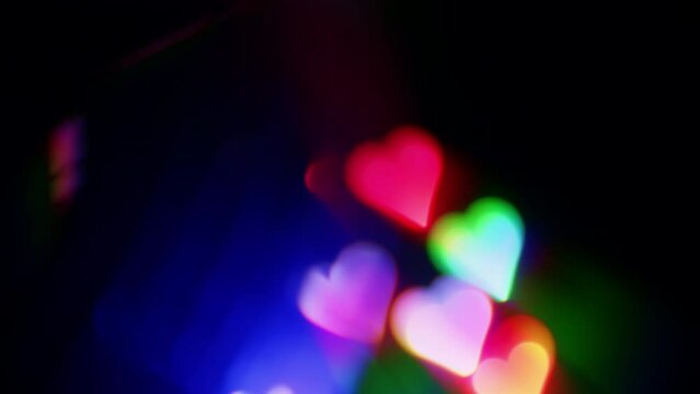 Glowing multicoloured disco hearts