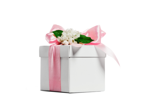 White gift box with pink ribbon bow and white spring flowers on top. Cut out without background.. Wedding Easter or birthday gift packaging isolated on transparent background