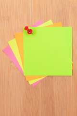 Colored Sticky Notes with Copyspace Pinned to the Wooden Message Board. To Do List Reminder in Office. Blank Memo Sticker at Work - Template. Empty Checklist - Mockup