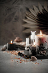 wellness salon concept, burning candles, stones, salt, spa, relaxation