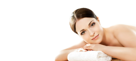 Beautiful and healthy brunette woman is getting massage treatment in spa salon. Spa, health and healing concept.