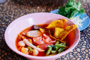 Close up of noodle in pink broth ( Yentafo ) - delicious and healthy street food in Thailand