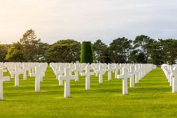 Fototapeta na wymiar American cemetery at Omaha Beach, with blue summer sky and a warm sunshine