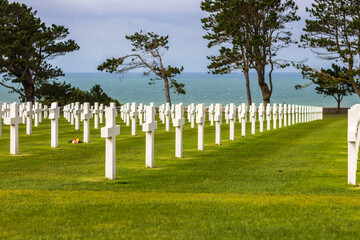 Fototapeta na wymiar American cemetery on Omaha Beach, overlooking ocean and dramatic sky