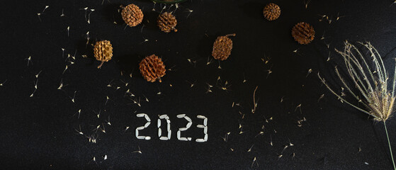 Happy new year 2022 background, holidays card with lights, gifts and pine cone