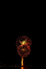 Fototapeta premium Firework on Black Dark Sky Background,Celebrate Party Merry Christmas and Happy New Year Festival,Light Bright Bokeh Gold Abstract Burst Fire Anniversary Birthday Holidays Wallpaper,Colorful Night.