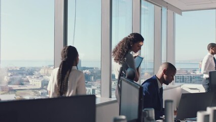 Staff, busy and business people walking in office, working in corporate, financial and modern company. Teamwork, collaboration and efficient employees with project in workplace with city background - Powered by Adobe