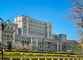 Fototapeta na wymiar The Palace of the Parliament, Bucharest, Romania –exterior facade on a sunny day. This colossal building is the second-largest administrative building in the world after the Pentagon.