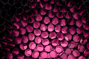 Closeup of black straw tip on pink background, Plastic straw tip, Hollow Tube on pink background.