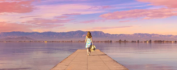 Zelfklevend Fotobehang Walking on wooden pier at sunset © M.studio