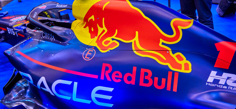 Red Bull trademark with red bull and yellow breath with inscription on the blue back of a formula racing car in Essen Germany, December 5, 2022