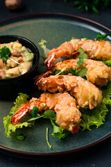 Asian traditional food fried shrimp in almond flakes with lettuce and vegetable dressing.