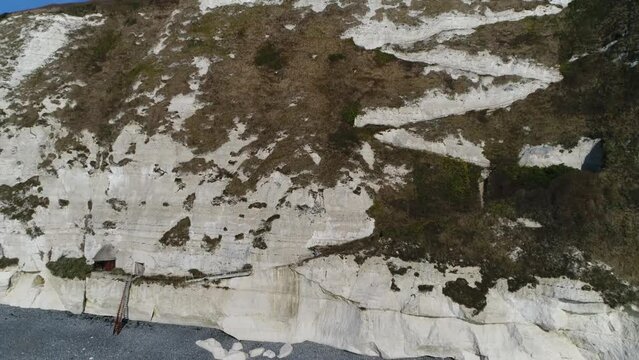 Aerial view of White Cliffs of Dover is region of English coastline facing the Strait and France it reaches a height of 350 feet and owes its striking appearance to its composition of chalk 4k
