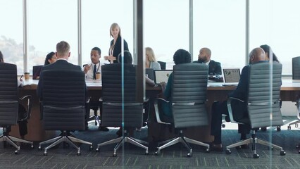 Business people, presentation or meeting in office building for company finance planning, growth strategy or data analysis. Mentor, diversity or speaker for leadership in workshop corporate training - Powered by Adobe