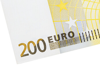 Part of the banknote denomination of 200 euros in close up, isolated on a white background to create business concepts.