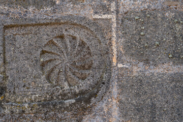 Funerary stele embedded in ancient wall, closeup