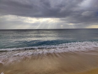 Fototapeta premium Sunrays piercing through the rainclouds in Kenting #2
