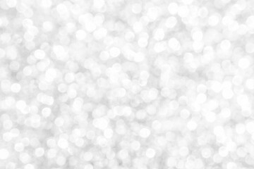 White and gray bokeh background. Photo can be used for the concepts of New Year, Christmas, Wedding Anniversary and all celebrations.	