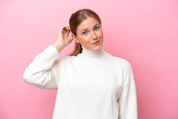 Young caucasian woman isolated on pink background with an expression of frustration and not understanding