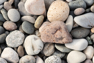 Fototapeta na wymiar sea pebbles background, beach stone texture