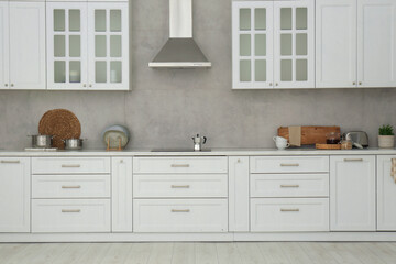 Naklejka na ściany i meble Beautiful kitchen interior with stylish modern furniture