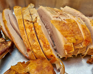 Freshly roasted turkey, sliced and ready to serve. A classic holidays meat plate.