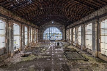 Old abandoned coal mine with a beautiful window, flooded with light. End time mood.