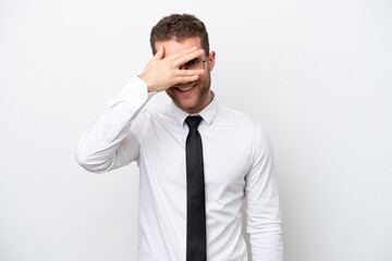 Young business caucasian man isolated on white background covering eyes by hands and smiling