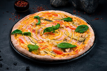 Pizza with Mozzarella cheese, Cheddar cheese, chicken ham, chicken fillet, mustard, cucumbers, tomatoes, oregano and basil.