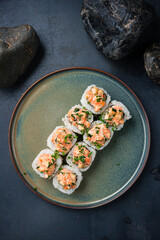 Rolls with shrimp, Philadelphia cheese, romaine, cucumber, tobiko caviar, herbs and spicy sauce.
