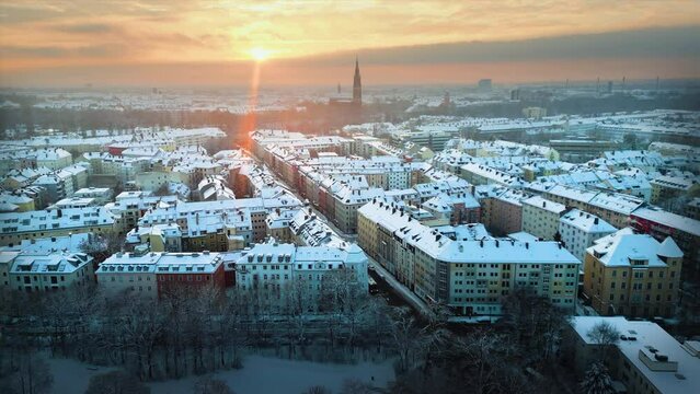 Munich winter snow skyline aerial view at sunrise panorama.