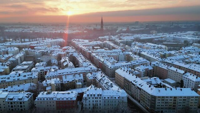 Munich winter city skyline aerial view, munich snow germany city winter time aerial view city downtown giesing cathedral.