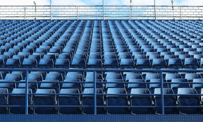 Empty stadium seats outdoor background.