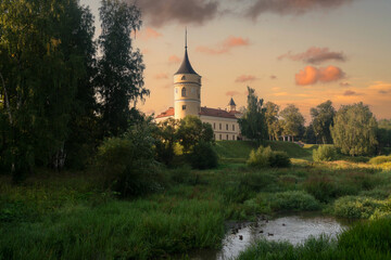 Fototapeta premium View of the Castle of the Russian Emperor Paul I-Marienthal (BIP fortress) from the Slavyanka River on a sunny summer morning, Pavlovsk, Saint Petersburg, Russia