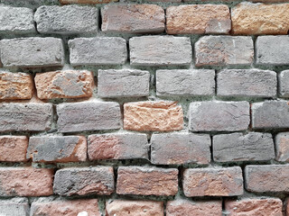 Rough brick wall background texture.