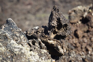 Different shapes of volcanic lava which solidified on Lanzarote Island 200 years ago, rocks, lava, photographed in November 2022, lava chimney, lava tunnel