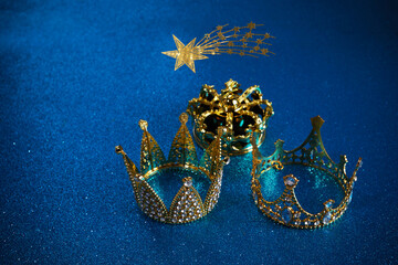 Three crowns of the three wise men with star over blue background. For Reyes Magos day and Happy...