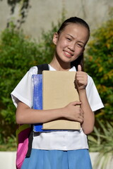 Fototapeta premium Student Teenager School Girl With Thumbs Up With Textbooks