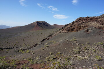 Volcanic landscapes of Lanzarote. Solidified lava, lava chimney, lava tunnel, sea of lava, eruption, canary islands, crater, volcano, black rocks, photographed in November 2022, trekking trip,